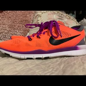 Orange and purple Nike free 8.5 lightly used